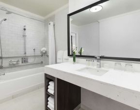 Guest bathroom with shower and tub at Hilton Boston Park Plaza.