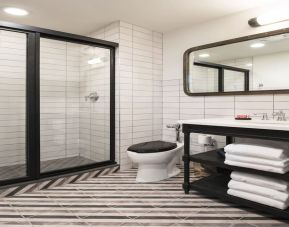 Guest bathroom with shower at The Chicago Hotel Collection River North.