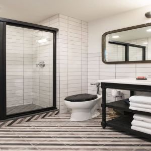 Guest bathroom with shower at The Chicago Hotel Collection River North.