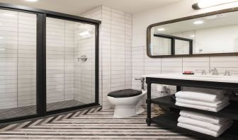 Guest bathroom with shower at The Chicago Hotel Collection River North.