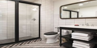 Guest bathroom with shower at The Chicago Hotel Collection River North.