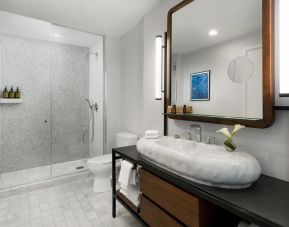 Private guest bathroom with shower at The James New York, NoMad.