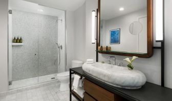 Private guest bathroom with shower at The James New York, NoMad.