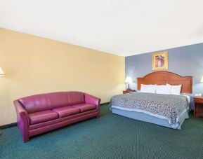 Spacious day use room with sofa at Blue Way Inn & Suites Wichita East.