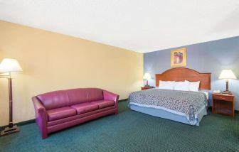 Spacious day use room with sofa at Blue Way Inn & Suites Wichita East.