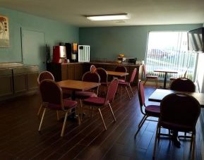 Dining area perfect for coworking at Blue Way Inn & Suites Wichita East.