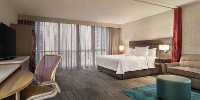 Spacious day use room with work desk and sofa at Home2 Suites By Hilton Chicago River North.
