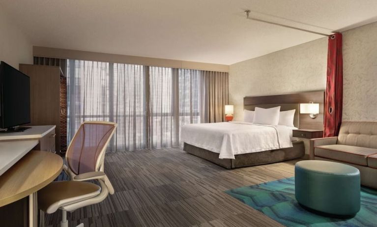 Spacious day use room with work desk and sofa at Home2 Suites By Hilton Chicago River North.
