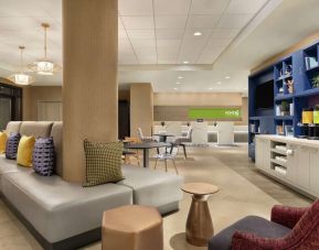 Lobby and coworking lounge at Home2 Suites By Hilton Chicago River North.
