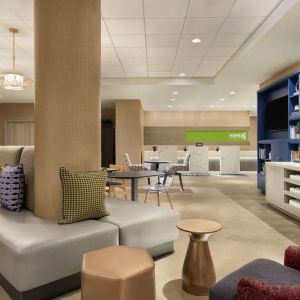 Lobby and coworking lounge at Home2 Suites By Hilton Chicago River North.
