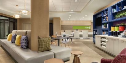 Lobby and coworking lounge at Home2 Suites By Hilton Chicago River North.
