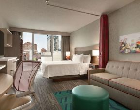 Day use room with work desk and sofa at Home2 Suites By Hilton Chicago River North.
