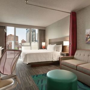 Day use room with work desk and sofa at Home2 Suites By Hilton Chicago River North.
