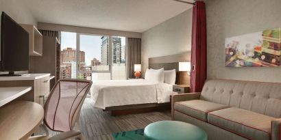 Day use room with work desk and sofa at Home2 Suites By Hilton Chicago River North.
