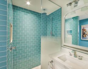 Guest bathroom with shower at Margaritaville Resort Times Square.