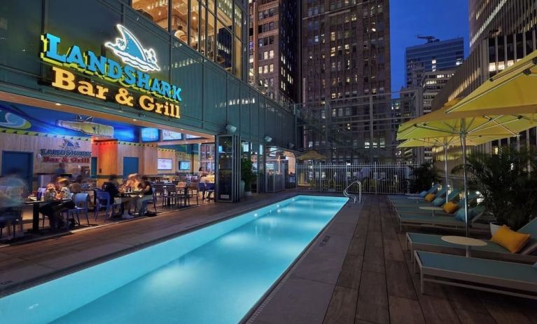 Outdoor pool at night at Margaritaville Resort Times Square.