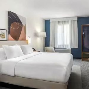 Day room with TV at Spark By Hilton Houston Hobby Airport.