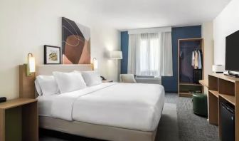 Day room with TV at Spark By Hilton Houston Hobby Airport.