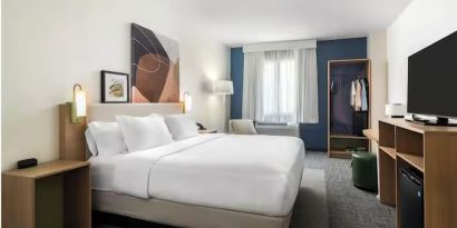 Day room with TV at Spark By Hilton Houston Hobby Airport.