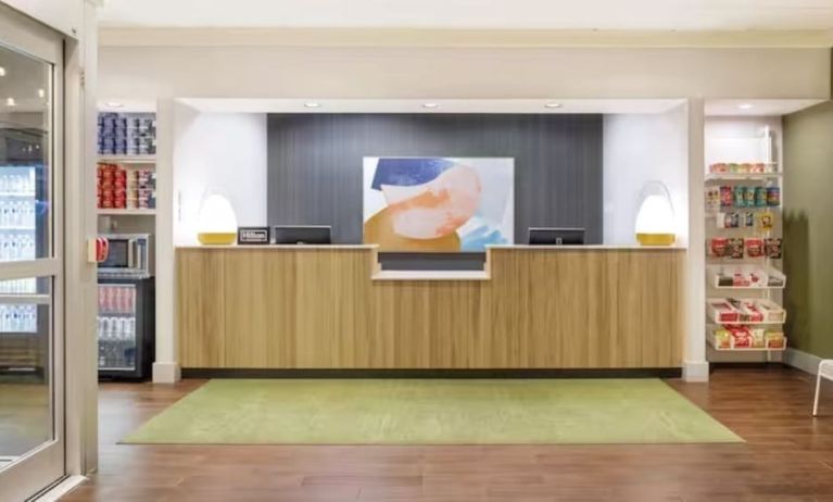 Reception and snack bar at Spark By Hilton Houston Hobby Airport.