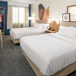 Day room with queen beds at Spark By Hilton Houston Hobby Airport.