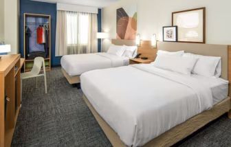 Day room with queen beds at Spark By Hilton Houston Hobby Airport.