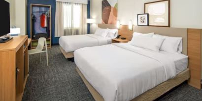 Day room with queen beds at Spark By Hilton Houston Hobby Airport.