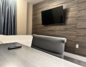 Day use room's include workdesk, private bathroom  and TV screen at Rose Hotel, Bronx.