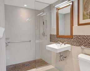 Guest bathroom with shower at Wyndham Garden Chinatown NYC.