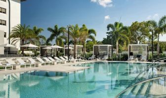 Refreshing outdoor pool surrounded by sun loungers at Renaissance Boca Raton Hotel.
