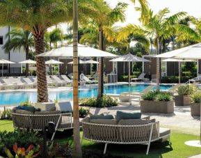 Lounge chairs beside the pool at Renaissance Boca Raton Hotel.
