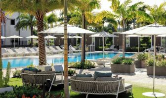 Lounge chairs beside the pool at Renaissance Boca Raton Hotel.
