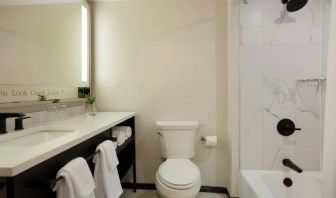 Guest bathroom with shower and tub at Renaissance Boca Raton Hotel.
