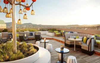 Outdoor furniture in rooftop perfect for coworking at The Plaza Pioneer Park, El Paso.