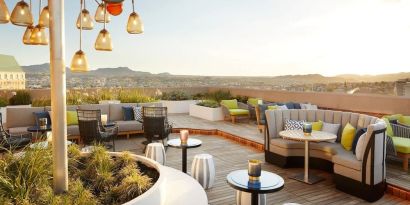 Outdoor furniture in rooftop perfect for coworking at The Plaza Pioneer Park, El Paso.