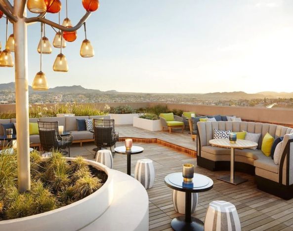 Outdoor furniture in rooftop perfect for coworking at The Plaza Pioneer Park, El Paso.