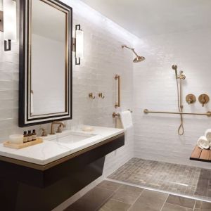 Guest bathroom with shower at The Plaza Pioneer Park, El Paso.