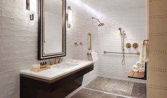 Guest bathroom with shower at The Plaza Pioneer Park, El Paso.