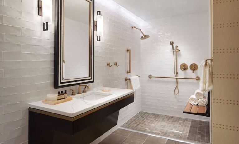 Guest bathroom with shower at The Plaza Pioneer Park, El Paso.