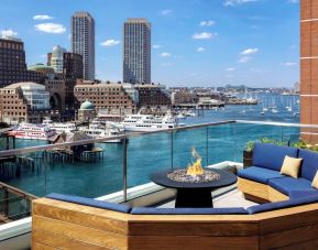 Rooftop furniture with fire pit at The Envoy Hotel, Autograph Collection.