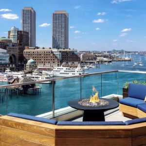 Rooftop furniture with fire pit at The Envoy Hotel, Autograph Collection.