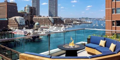 Rooftop furniture with fire pit at The Envoy Hotel, Autograph Collection.