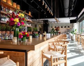 Bar and kitchen at The Envoy Hotel, Autograph Collection.