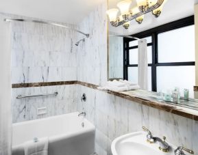 Guest bathroom with shower at The New Yorker Hotel, A Wyndham Hotel.