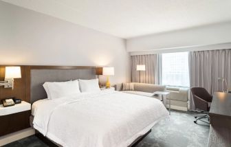 Day use room with work desk and sofa at Hampton Inn Philadelphia Center City - Convention Center.
