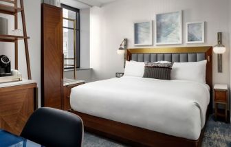 Delux king room with work desk at Rand Tower Hotel, Minneapolis, A Marriott Tribute Portfolio Hotel.