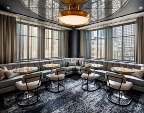 Dining area perfect for coworking at Rand Tower Hotel, Minneapolis, A Marriott Tribute Portfolio Hotel.