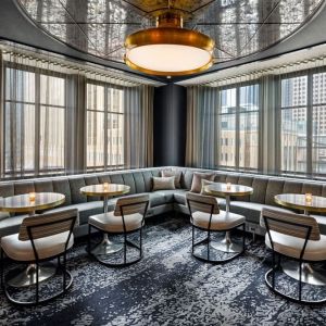 Dining area perfect for coworking at Rand Tower Hotel, Minneapolis, A Marriott Tribute Portfolio Hotel.