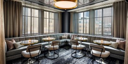 Dining area perfect for coworking at Rand Tower Hotel, Minneapolis, A Marriott Tribute Portfolio Hotel.