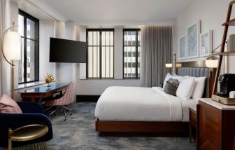 Delux king room with work desk at Rand Tower Hotel, Minneapolis, A Marriott Tribute Portfolio Hotel.